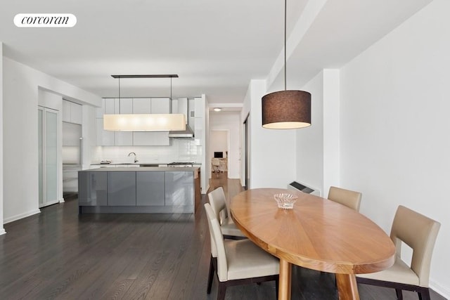 252 7th Ave Unit 10O, New York City, NY 10001 - dining room featuring dark wood finished floors and baseboards