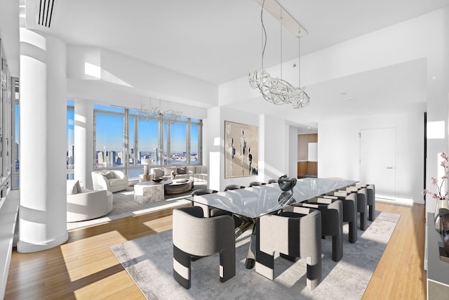2 River Ter Unit Rh-8, New York City, NY 10282 - dining area with a chandelier and wood finished floors
