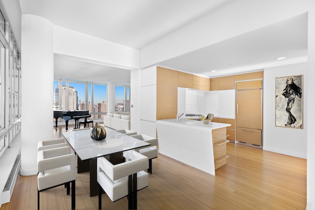 2 River Ter Unit Rh-8, New York City, NY 10282 - dining room featuring light wood-type flooring, recessed lighting, and a view of city