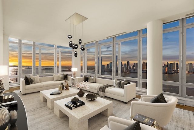 2 River Ter Unit Rh-8, New York City, NY 10282 - living room with expansive windows, a water view, and wood finished floors
