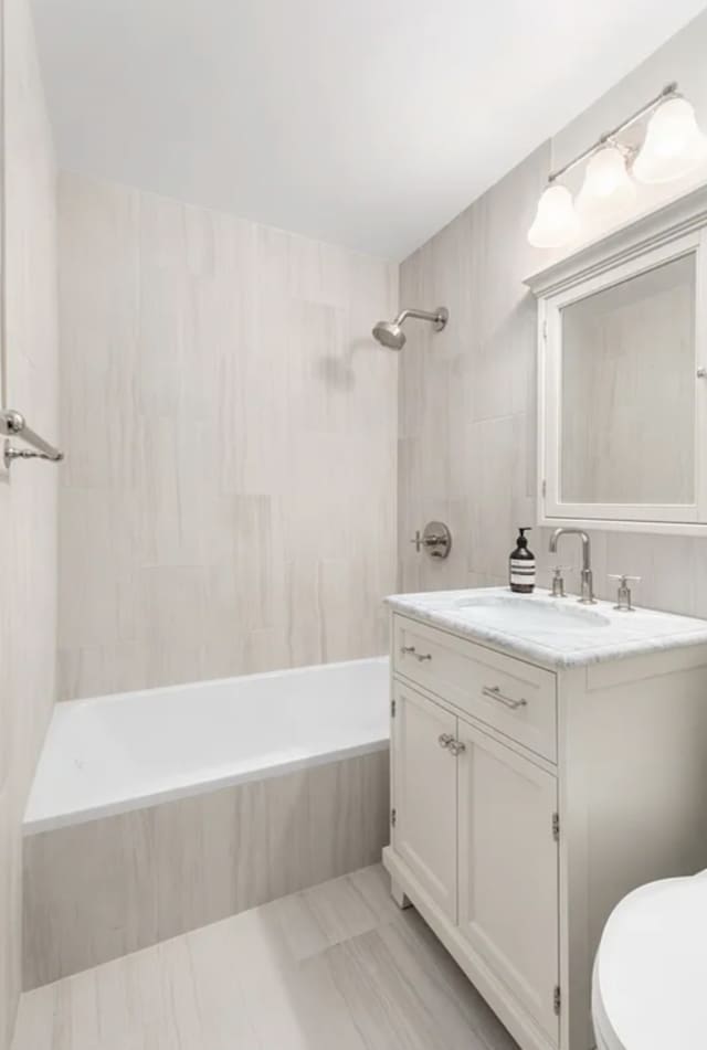 625 Main St Unit 1432, New York City, NY 10044 - full bath with vanity, tiled shower / bath combo, and marble finish flooring