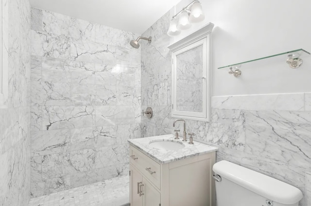 625 Main St Unit 1432, New York City, NY 10044 - bathroom featuring vanity, tiled shower, and tile walls