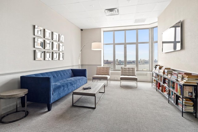 500 W 43rd St Unit 21-B, New York City, NY 10036 - carpeted living area featuring a drop ceiling