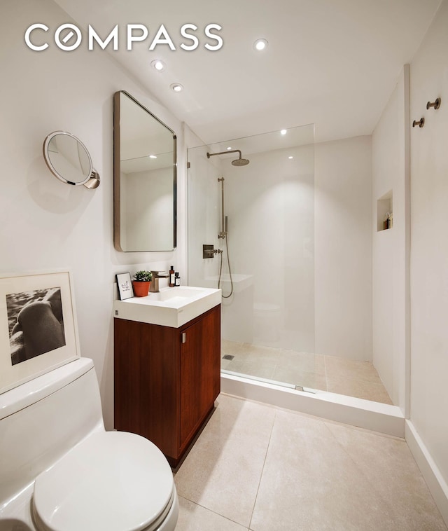 425 E 13th St Unit 3F, New York City, NY 10009 - bathroom with a walk in shower, vanity, tile patterned flooring, and recessed lighting