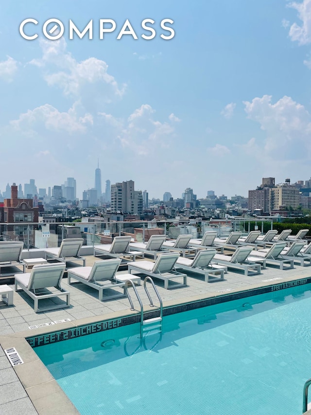 425 E 13th St Unit 3F, New York City, NY 10009 - community pool with a view of skyline and a patio