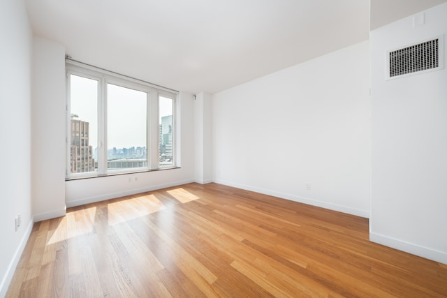 15 William St Unit 39F, New York City, NY 10004 - unfurnished room with light wood-style floors