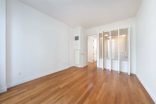 15 William St Unit 39F, New York City, NY 10004 - unfurnished bedroom with light wood-type flooring and baseboards