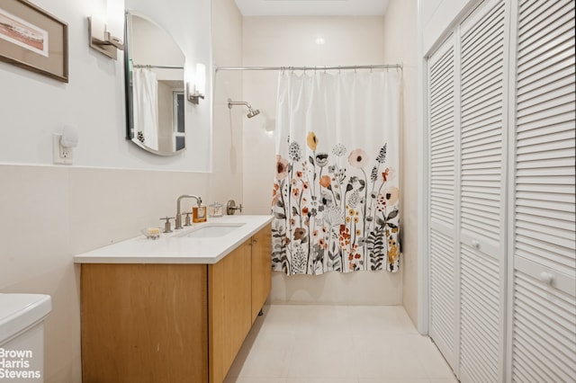 302 W 122nd St Unit 1, New York City, NY 10027 - bathroom with vanity, a closet, and a shower with shower curtain