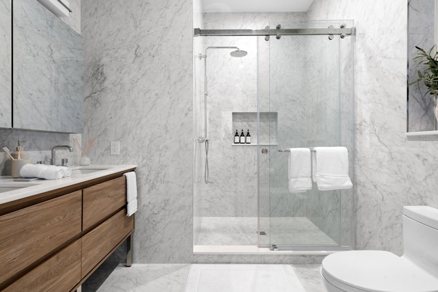 205 14th St Unit Th, New York City, NY 11215 - bathroom with tile walls, double vanity, a marble finish shower, and marble finish flooring