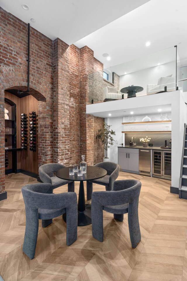 205 14th St Unit Th, New York City, NY 11215 - dining area featuring a high ceiling, brick wall, a community bar, and recessed lighting