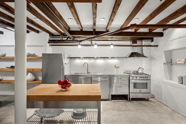 222 E 17th St Garden, Unit Garden, New York City, NY 10003 - kitchen with stainless steel countertops, stainless steel appliances, wall chimney exhaust hood, concrete flooring, and backsplash