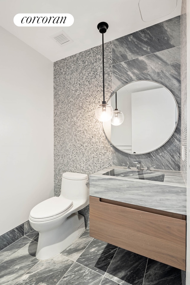 30 Riverside Blvd Unit 21G, New York City, NY 10069 - bathroom with marble tiled flooring, tile walls, and vanity