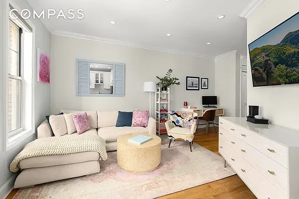 204 W 10th St Unit 18, New York City, NY 10014 - living room with wood finished floors, crown molding, a desk, and recessed lighting