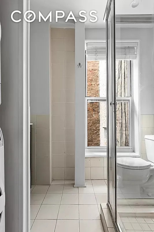 204 W 10th St Unit 18, New York City, NY 10014 - bathroom with toilet and tile patterned flooring