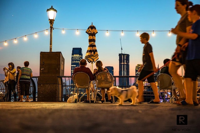 2 River Ter Unit 9-A, New York City, NY 10282 - playground at dusk featuring a skyline view