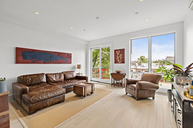 148 W 121st St Unit 5, New York City, NY 10027 - living area featuring light wood-style floors, recessed lighting, and an AC wall unit