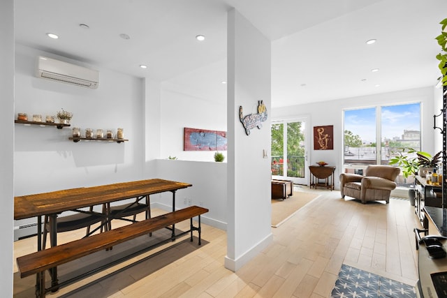 148 W 121st St Unit 5, New York City, NY 10027 - hallway with a wall mounted air conditioner, light wood finished floors, recessed lighting, and a baseboard radiator