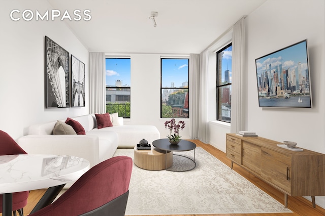 214 Mulberry St Unit 6B, New York City, NY 10012 - living area with wood finished floors and plenty of natural light