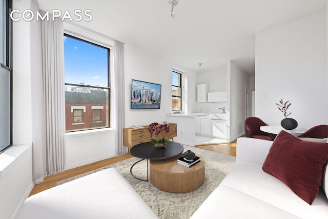 214 Mulberry St Unit 6B, New York City, NY 10012 - living room with light wood finished floors and baseboards