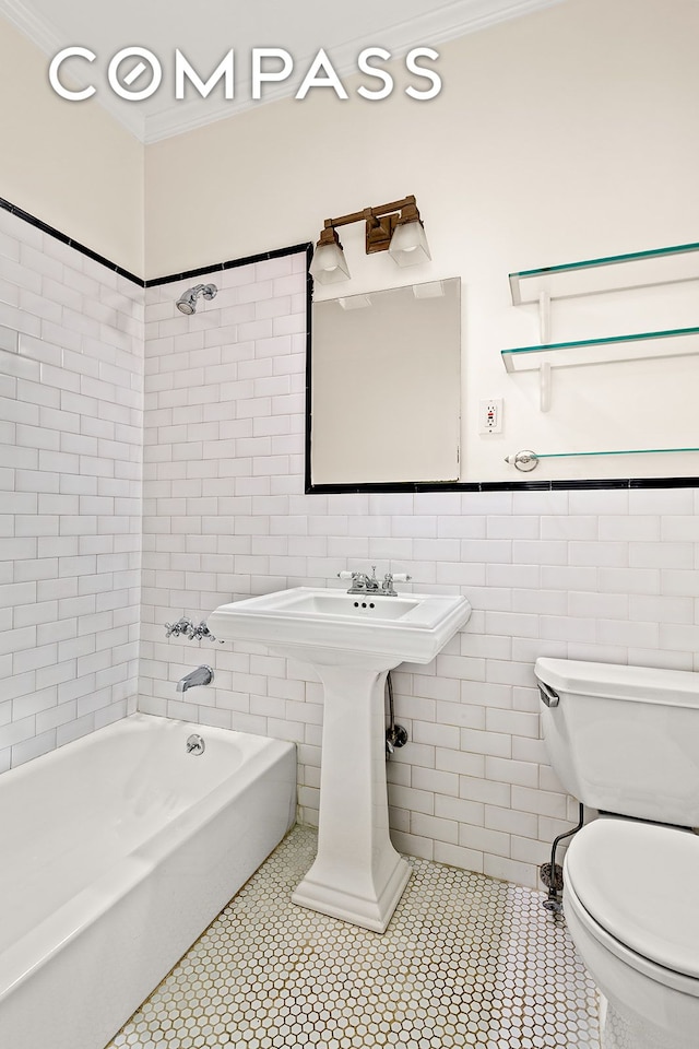 689 Fort Washington Ave Unit 1Aa, New York City, NY 10040 - full bathroom featuring tile walls, ornamental molding, bathing tub / shower combination, and tile patterned flooring