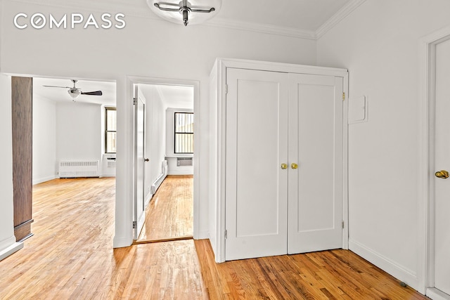 689 Fort Washington Ave Unit 1Aa, New York City, NY 10040 - hall featuring radiator heating unit, ornamental molding, and light wood finished floors
