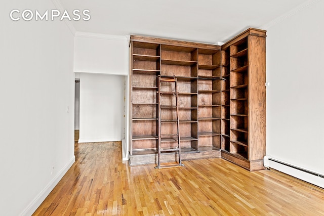 689 Fort Washington Ave Unit 1Aa, New York City, NY 10040 - spare room with wood finished floors, crown molding, and a baseboard radiator