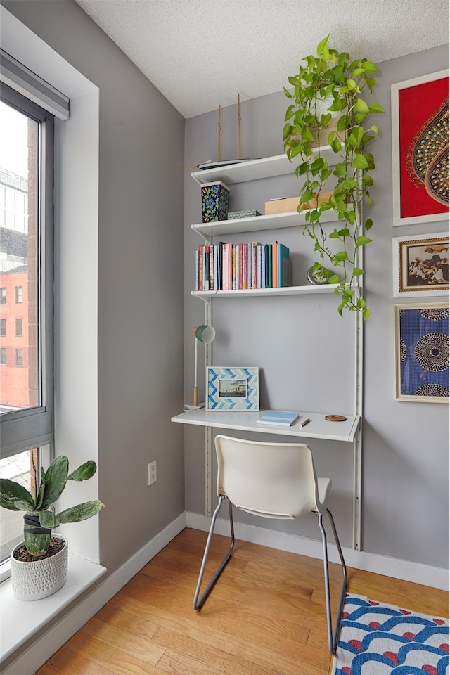 555 W 23rd St Unit N7H, New York City, NY 10011 - office featuring wood finished floors and a textured ceiling