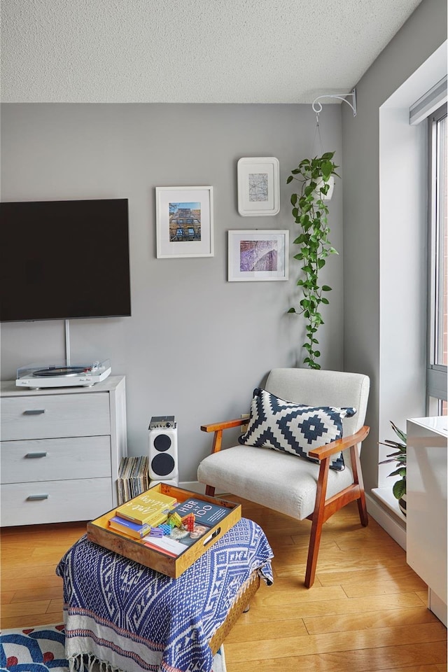 555 W 23rd St Unit N7H, New York City, NY 10011 - sitting room with wood-type flooring and a textured ceiling