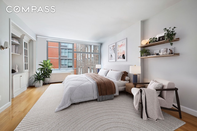 151 W 17th St Unit 5A, New York City, NY 10011 - bedroom with wood finished floors and baseboards
