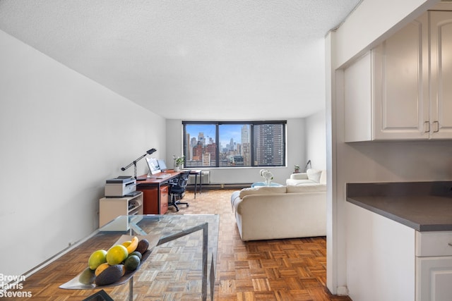 1619 3rd Ave Unit 17J, New York City, NY 10128 - living room with an office area, a view of city, and a textured ceiling