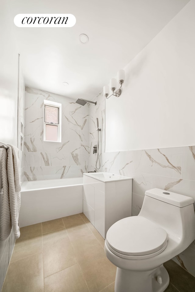 2525 Nostrand Ave Unit 3F, New York City, NY 11210 - bathroom featuring vanity, bathtub / shower combination, tile walls, and a wainscoted wall