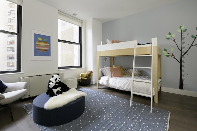 25 Broad St Unit 19-S, New York City, NY 10004 - bedroom with wood finished floors and radiator heating unit
