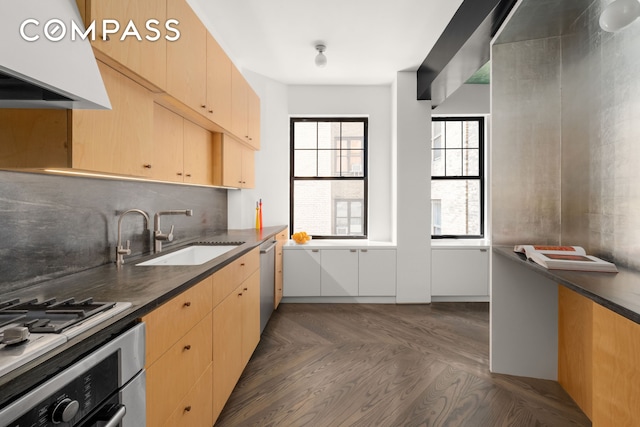 170 2nd Ave Unit 5A, New York City, NY 10003 - kitchen with range hood, wall oven, stainless steel dishwasher, light brown cabinetry, and dark countertops