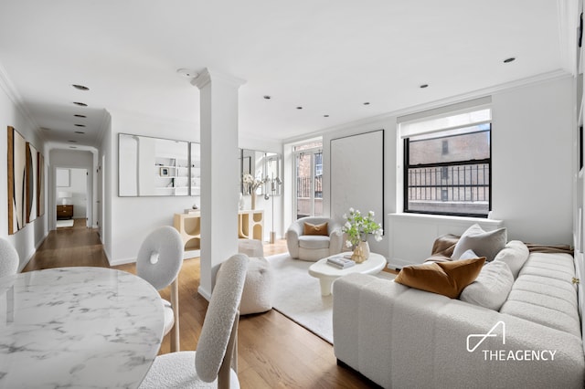 112 E 83rd St Unit 7A, New York City, NY 10028 - living room with crown molding, wood finished floors, and recessed lighting