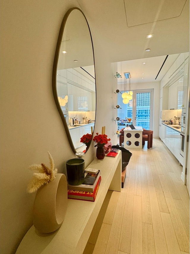 200 E 59th St Unit 8B, New York City, NY 10022 - corridor with light wood-style flooring