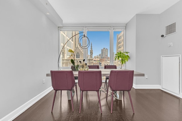 408 E 79th St Unit 8B, New York City, NY 10021 - dining area featuring wood finished floors and a skyline view