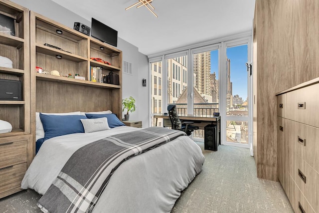 408 E 79th St Unit 8B, New York City, NY 10021 - bedroom with access to outside and carpet flooring