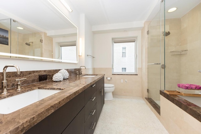 408 E 79th St Unit 8B, New York City, NY 10021 - full bath with a shower stall, plenty of natural light, double vanity, and tile walls