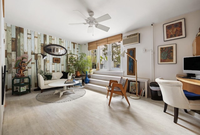 200 Mercer St Unit Ph4C, New York City, NY 10012 - living room with a wall mounted AC, a ceiling fan, an office area, wallpapered walls, and wood finished floors