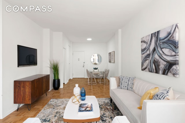 201 E 21st St Unit 15C, New York City, NY 10010 - living room featuring recessed lighting and baseboards
