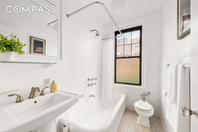 170 2nd Ave Unit 5C, New York City, NY 10003 - full bathroom featuring tile walls and shower / bath combo with shower curtain