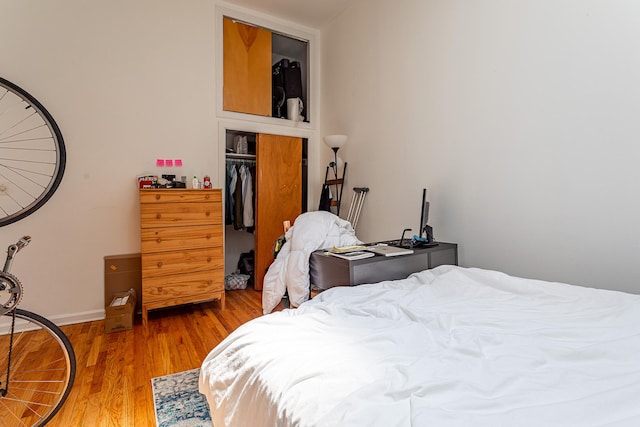 298 12th St Unit 4F, New York City, NY 11215 - bedroom with light wood finished floors and baseboards