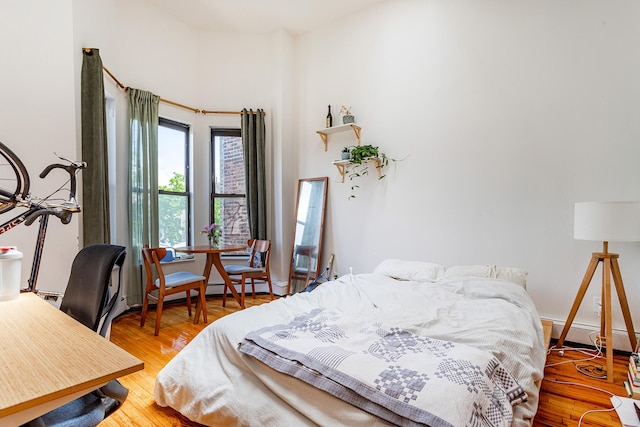 298 12th St Unit 4F, New York City, NY 11215 - bedroom with a baseboard radiator and wood finished floors