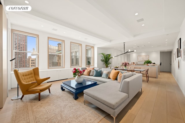 270 Broadway Unit 18C, New York City, NY 10007 - living room featuring a chandelier, beamed ceiling, recessed lighting, and light wood-style flooring