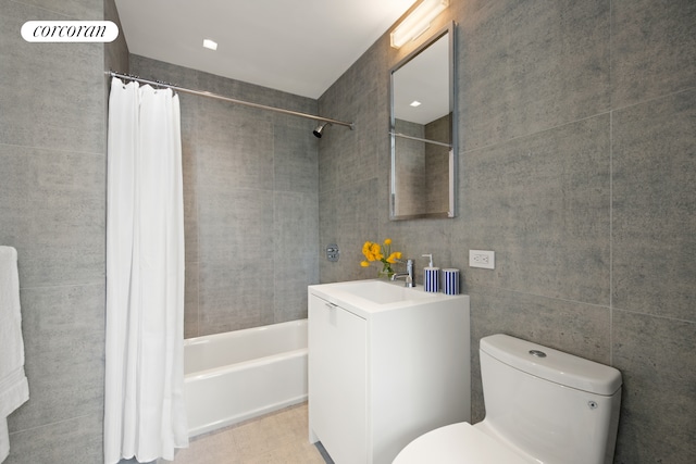 270 Broadway Unit 18C, New York City, NY 10007 - bathroom featuring shower / tub combo, tile walls, and vanity