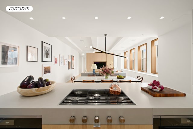 270 Broadway Unit 18C, New York City, NY 10007 - kitchen with stainless steel gas cooktop, open floor plan, recessed lighting, wine cooler, and a chandelier