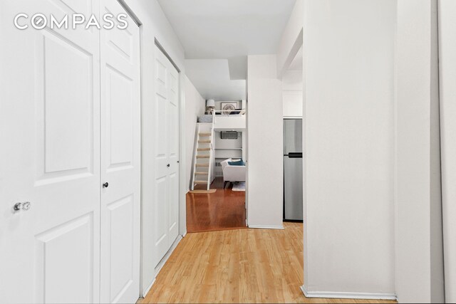215 E 24th St Unit 412A, New York City, NY 10010 - hall featuring light wood-style flooring