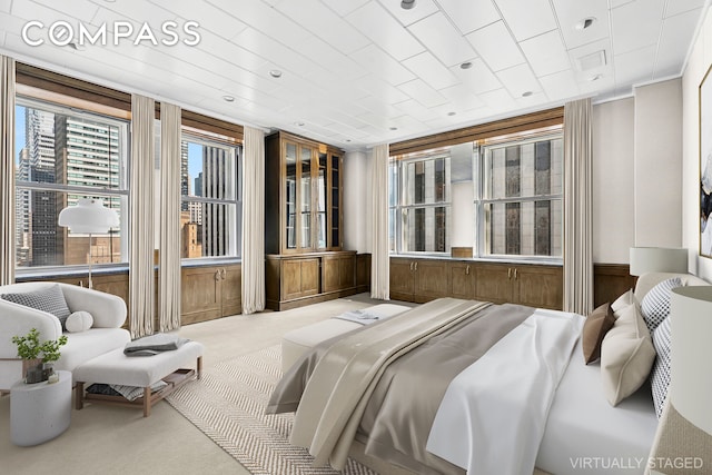781 5th Ave Unit 17, New York City, NY 10022 - carpeted bedroom featuring wooden walls