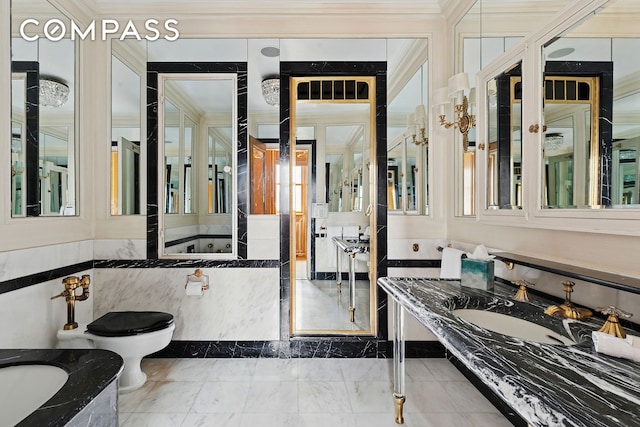 781 5th Ave Unit 17, New York City, NY 10022 - full bathroom with a bath, ornamental molding, marble tiled floors, and vanity