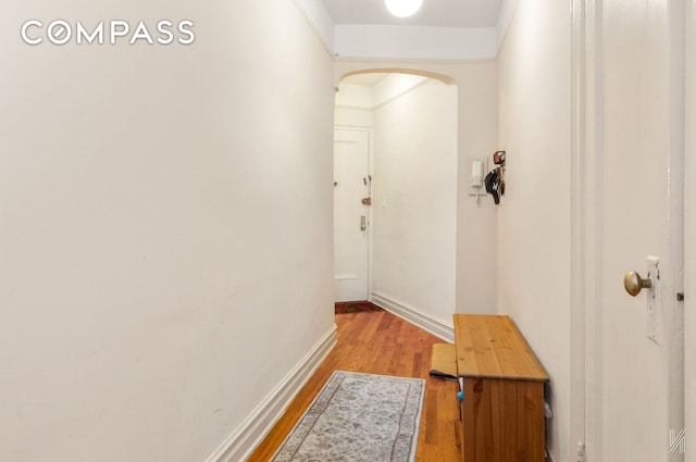 79-15 35th Ave Unit 3E, New York City, NY 11372 - corridor with arched walkways and light wood-style floors